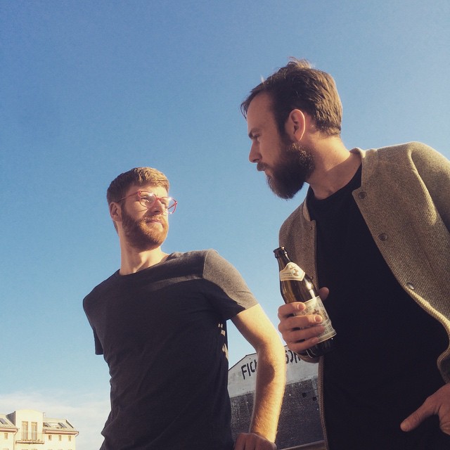 Roel van der Ven and Fabian Mürmann in the sun having a beer