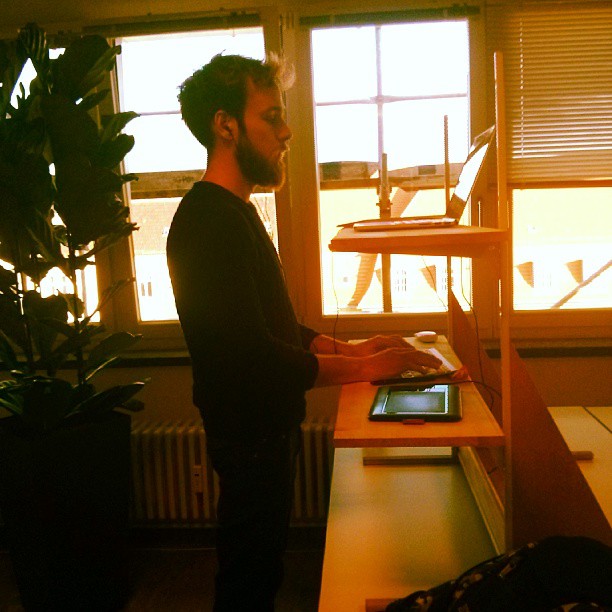 Roel is working at a make-shift standing desk at SoundCloud