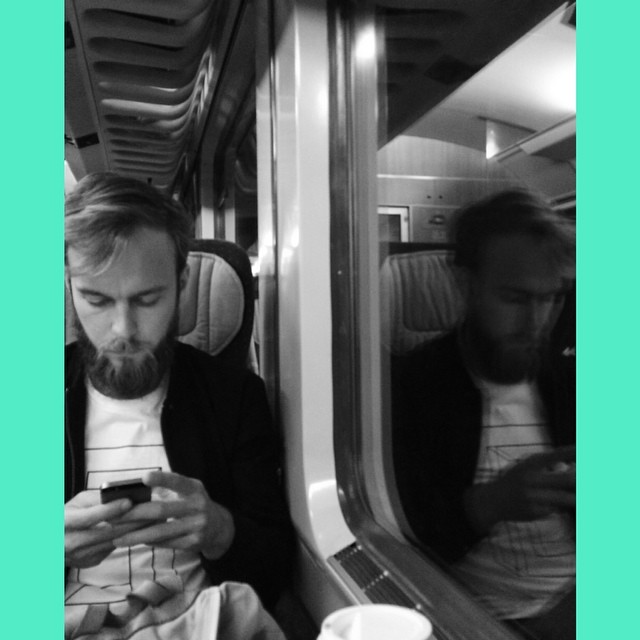 Roel van der Ven in a window seat in a German train